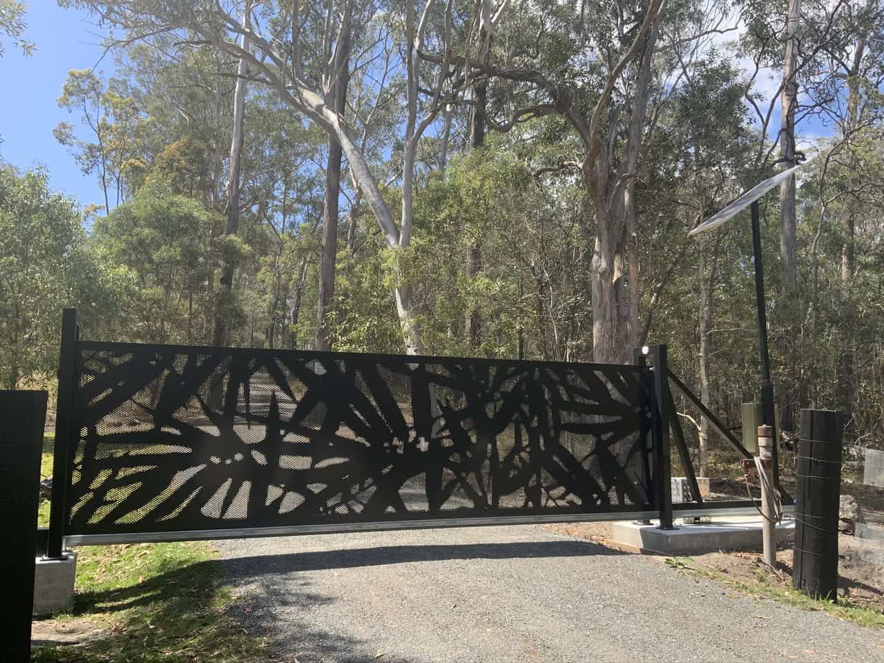 Automatic gate with decorative black metal design at Redland Bay, SE QLD.