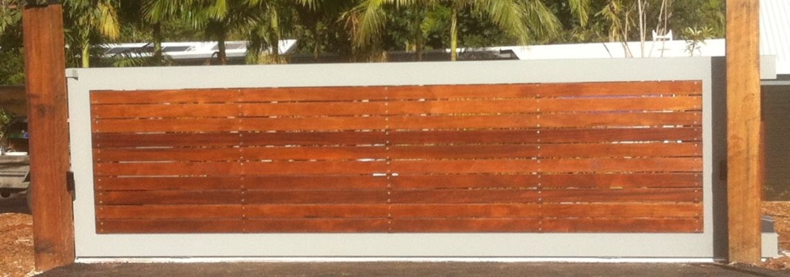 Sliding gate with aluminium frame & natural wood cladding, installed in the Gold Coast Hinterland