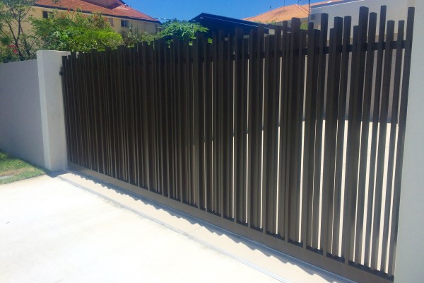 Custom black aluminium sliding gate with vertical uprights